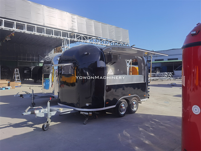 Fully equipped, black Airstream-style food vending trailer, 4m in length.