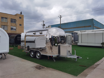 Yowon Commercial Shiny food truck equipped with kitchen appliances.