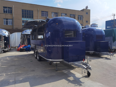commercial food trailer, crafted in the iconic Airstream style for the US market, features a sophisticated deep blue high-gloss finish.